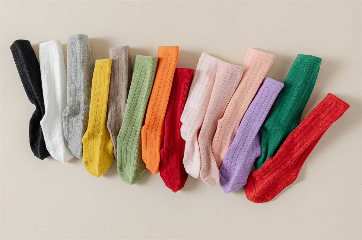 Bulk cotton baby socks in assorted colors, perfect for wholesale collections. Bulk cotton baby socks in assorted colors, perfect for wholesale collections.