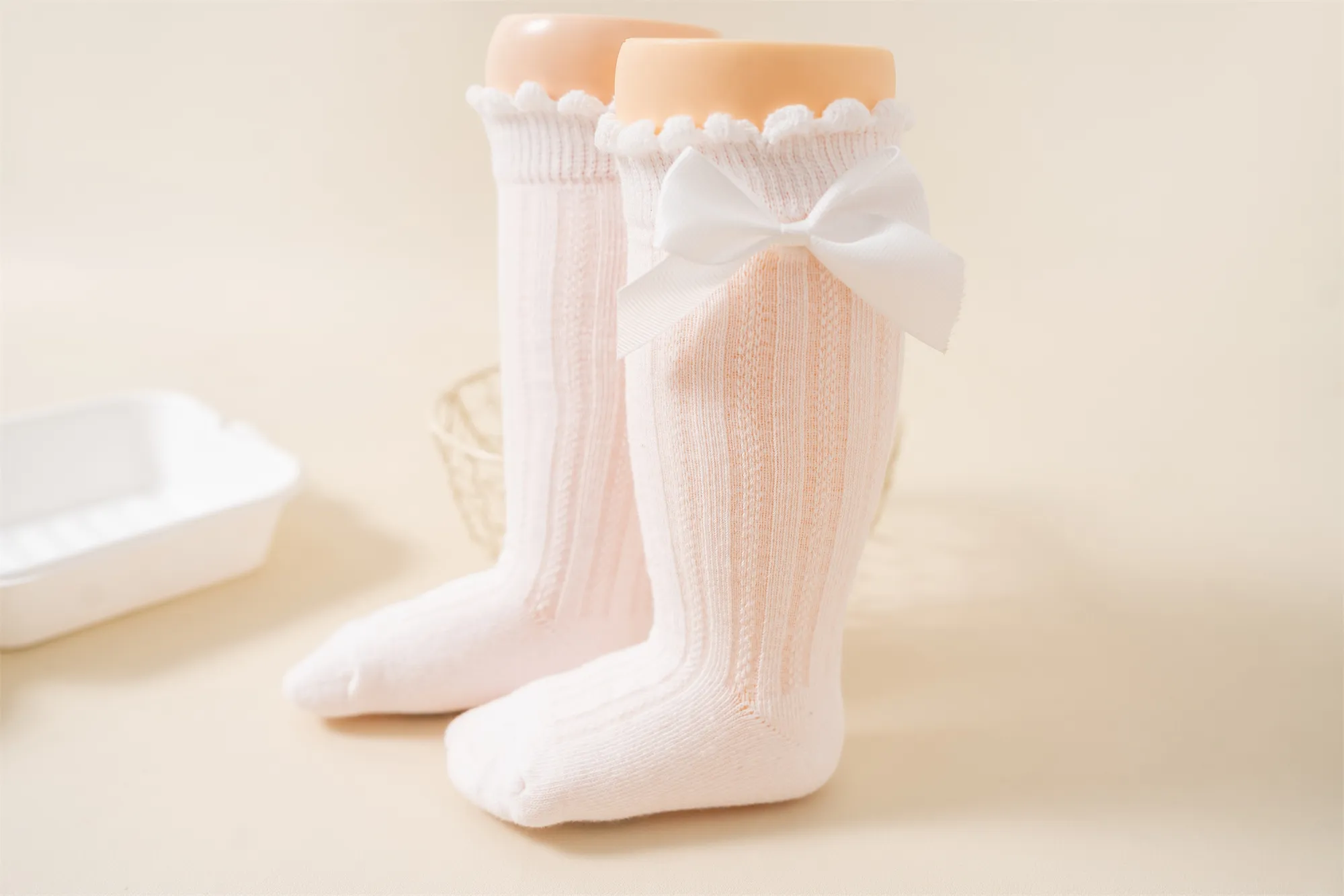 Baby girls knee high socks wearing effect with bow detail