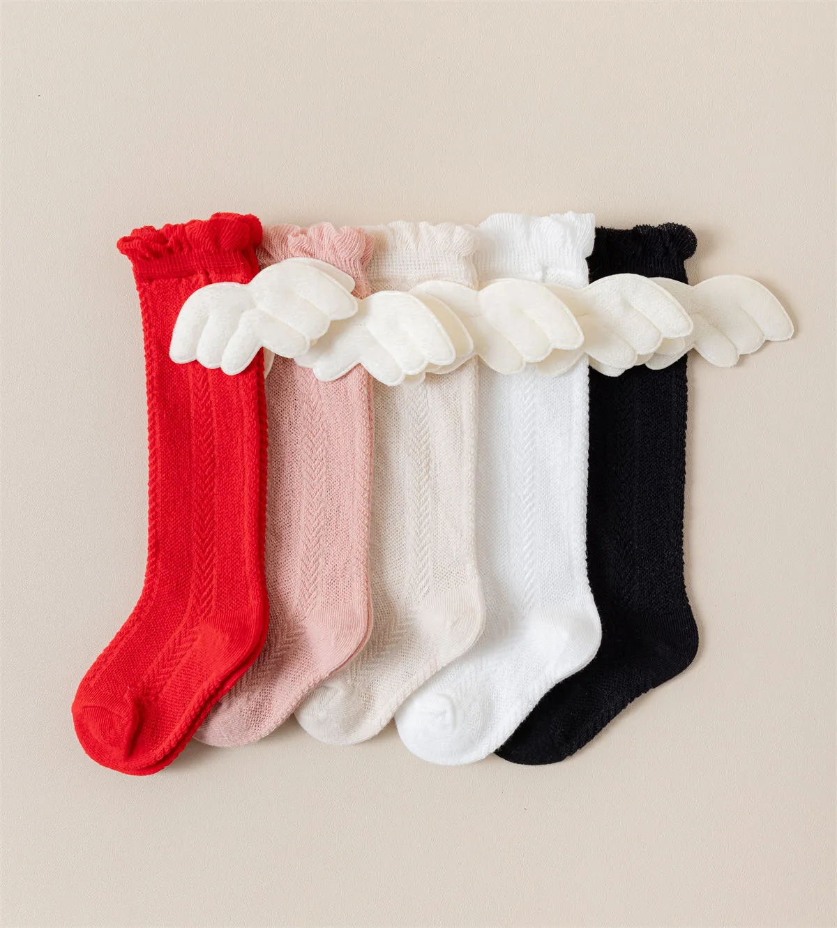 Bulk knee high baby socks with angel wings available in multiple colors for wholesale. Bulk knee high baby socks with angel wings available in multiple colors for wholesale.